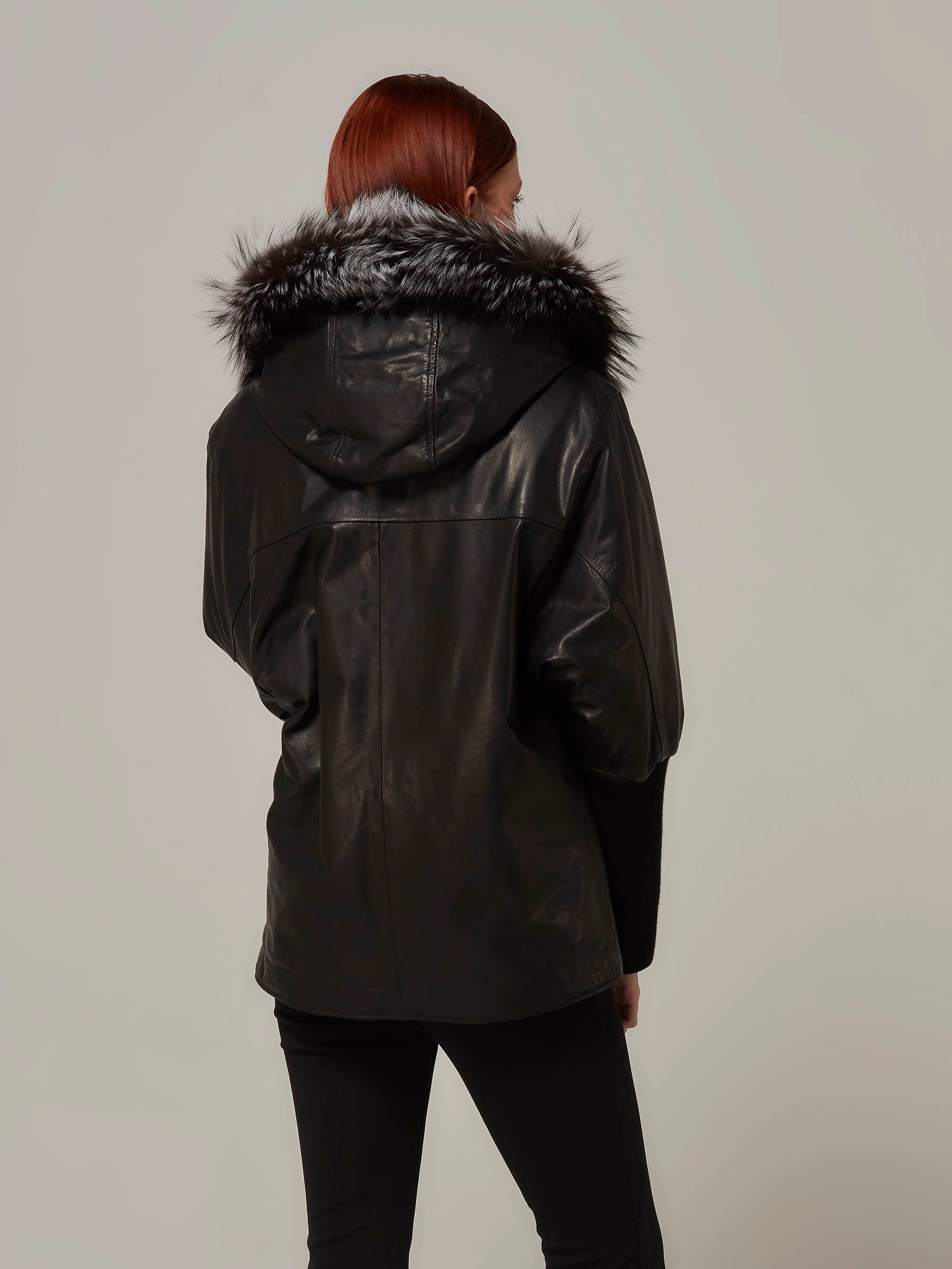 Black Reversible Leather Puffer JAcket with Fox Fur Hood back pose