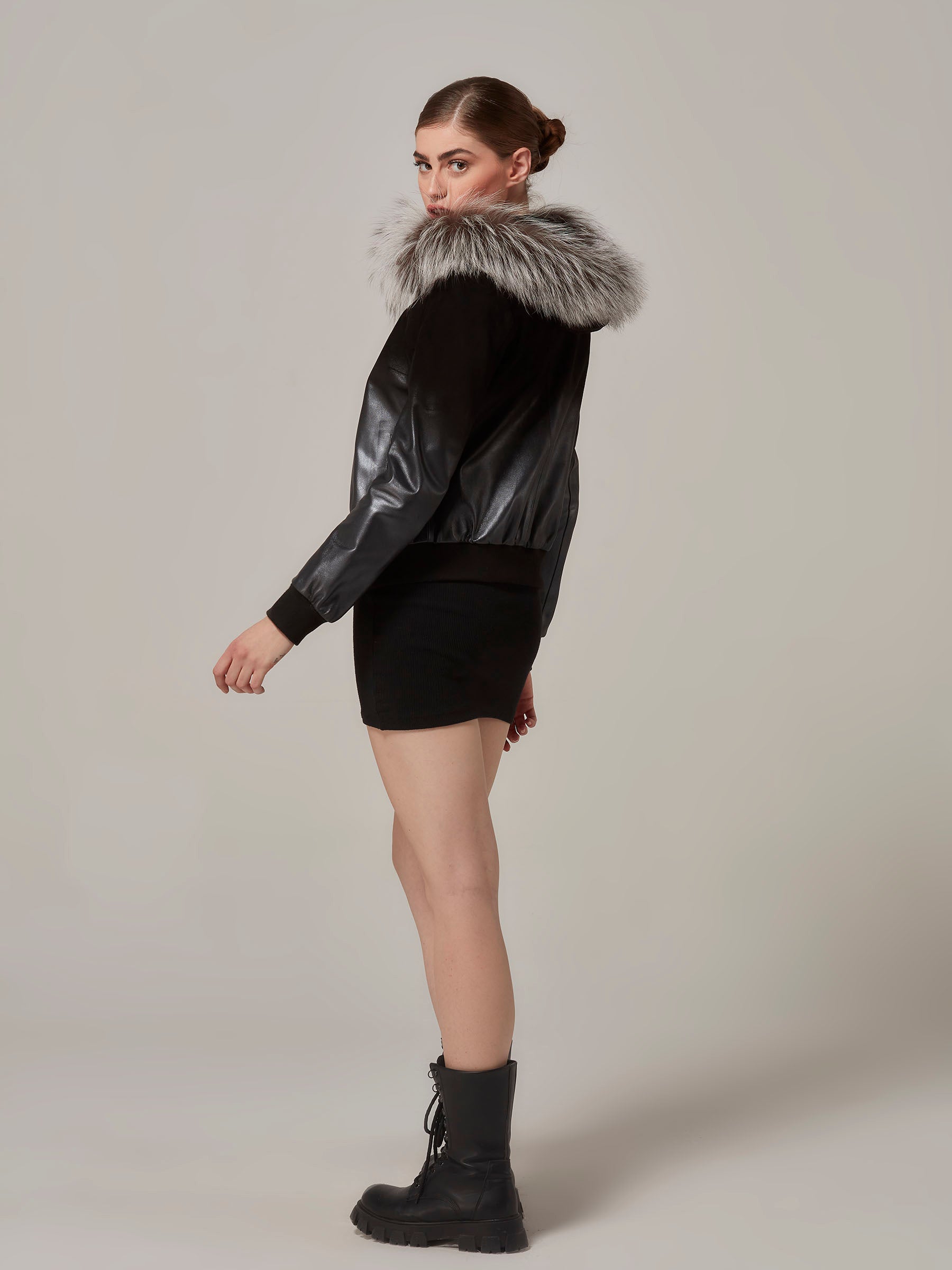 Black Leather to Suede Gradient Bomber Jacket with Fox Fur Hood side full length pose