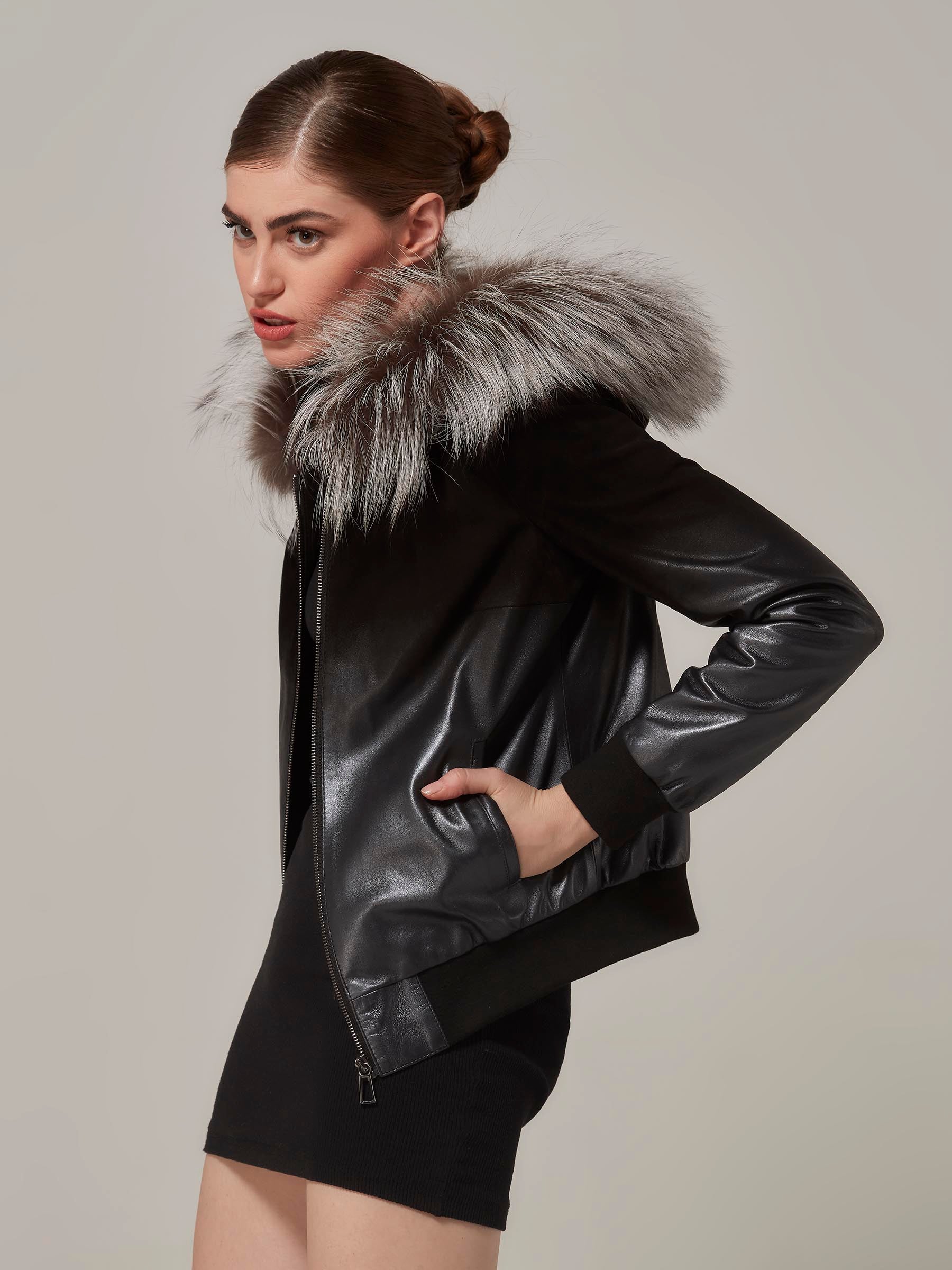 Black Leather to Suede Gradient Bomber Jacket with Fox Fur Hood side closeup pose