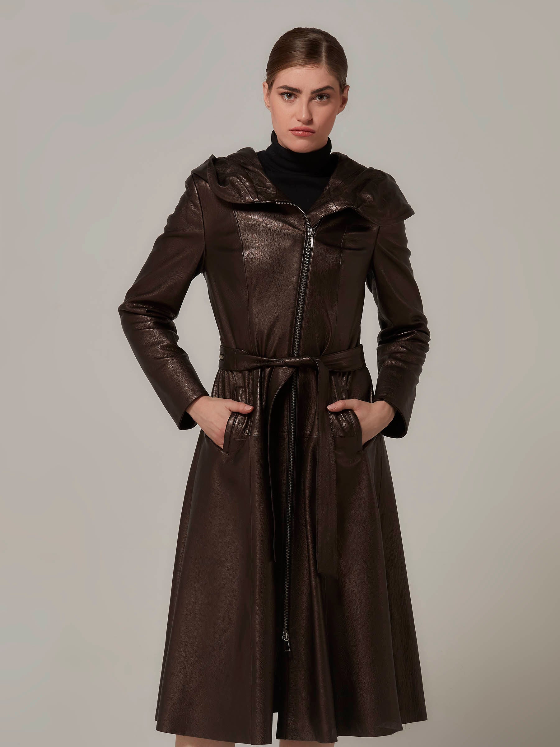 dark bronze leather coat with hood woman standing full