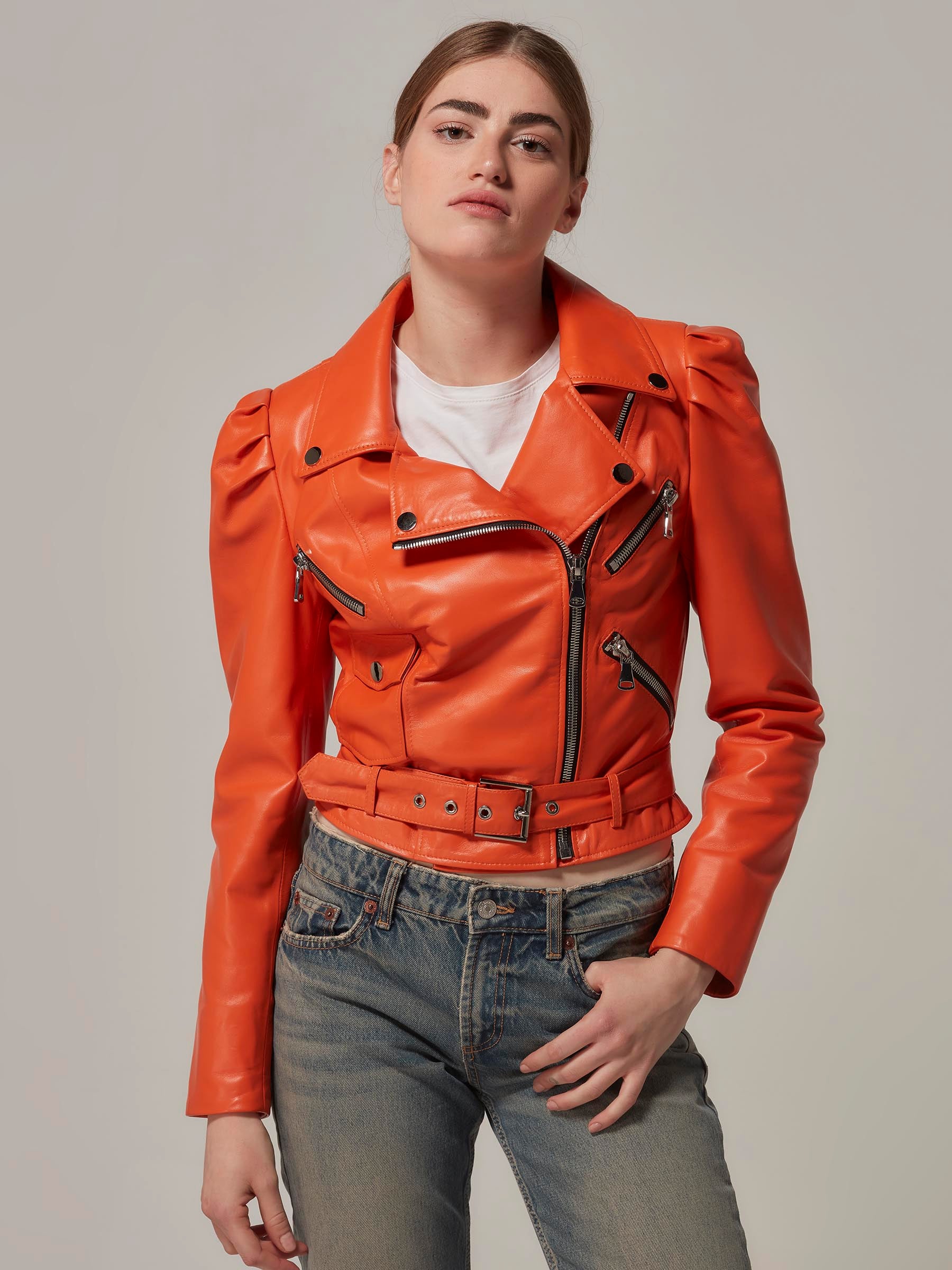 Orange Cropped Leather Motorcycle Jacket with Puffy Shoulders front close up pose